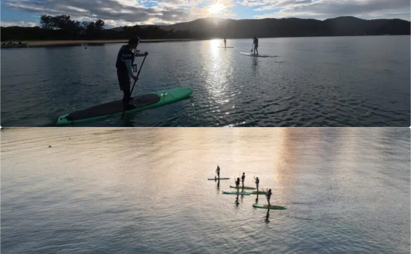 奄美大島でサンセットSUPを楽しむ人々